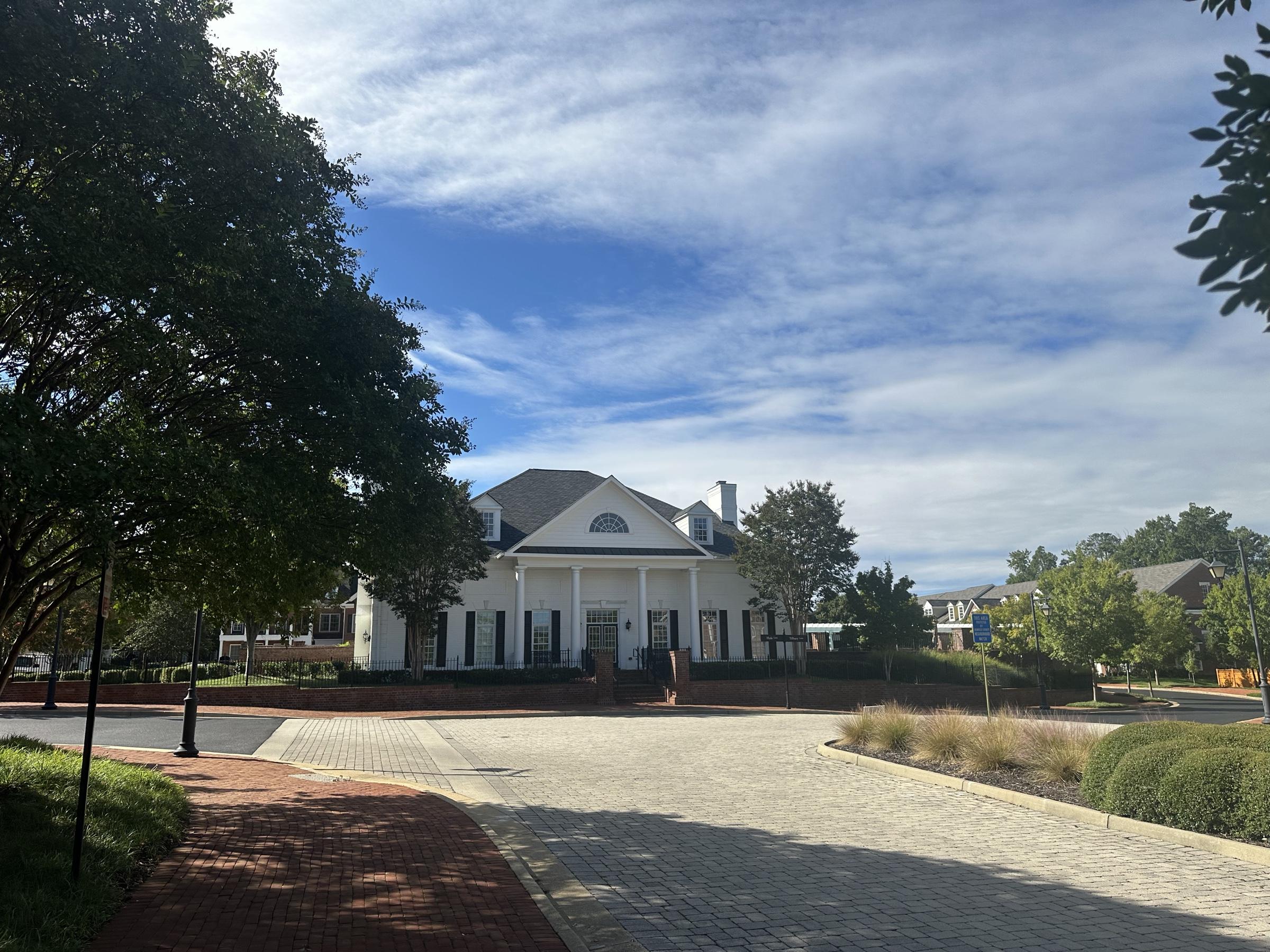 The Grayson Hill clubhouse at the end of a paved drive