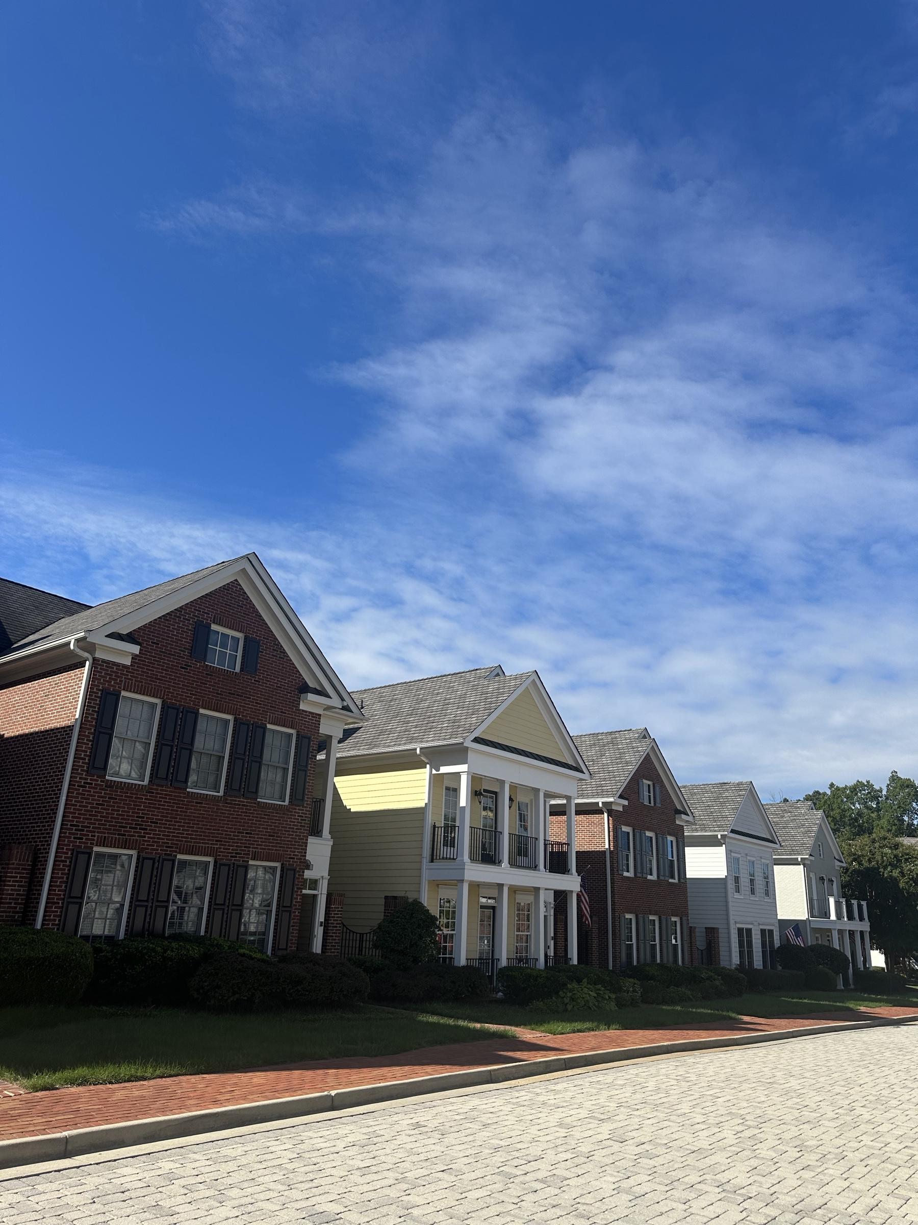 Brick townhomes along a street at Grayson Hill in Henrico County