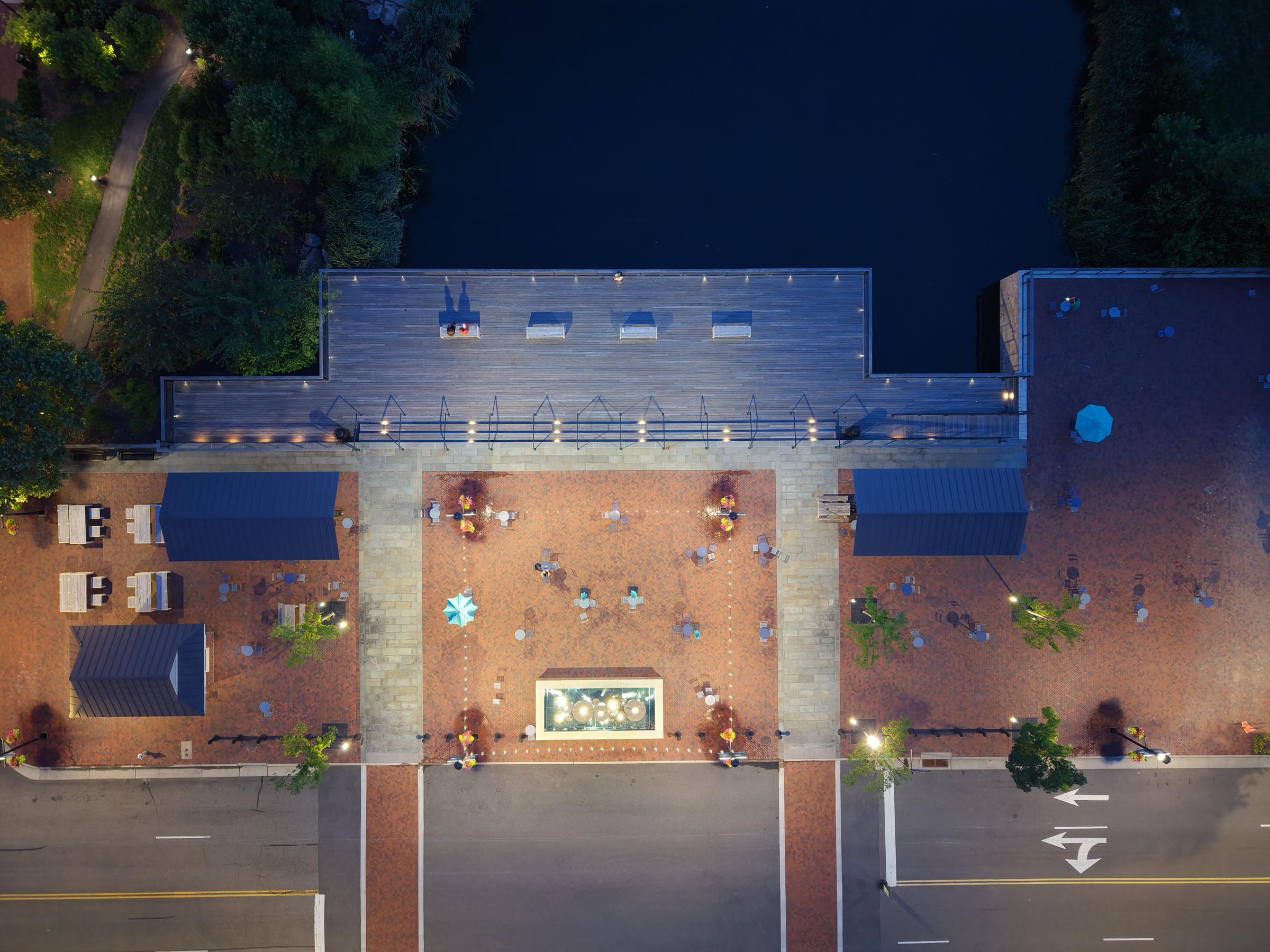 Overhead night view of the lit plaza at Libbie Mill