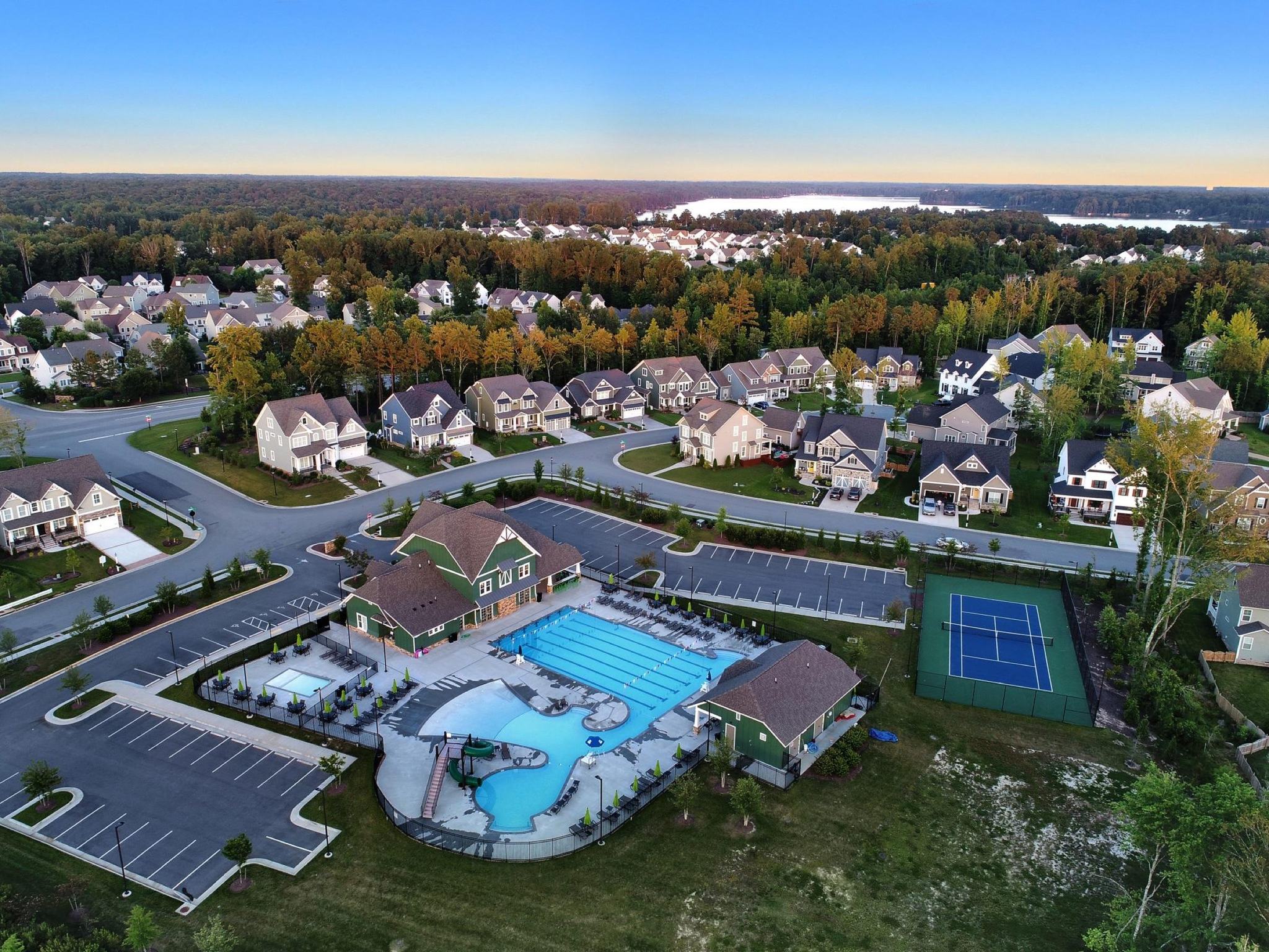 Aerial view of the Rountrey neighborhood and its amenity center at sunset