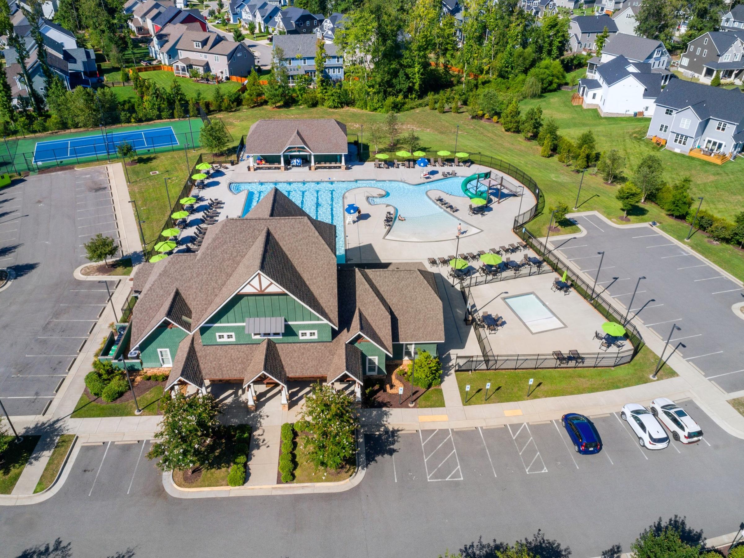 Aerial view of the Rountrey clubhouse, pools and tennis court