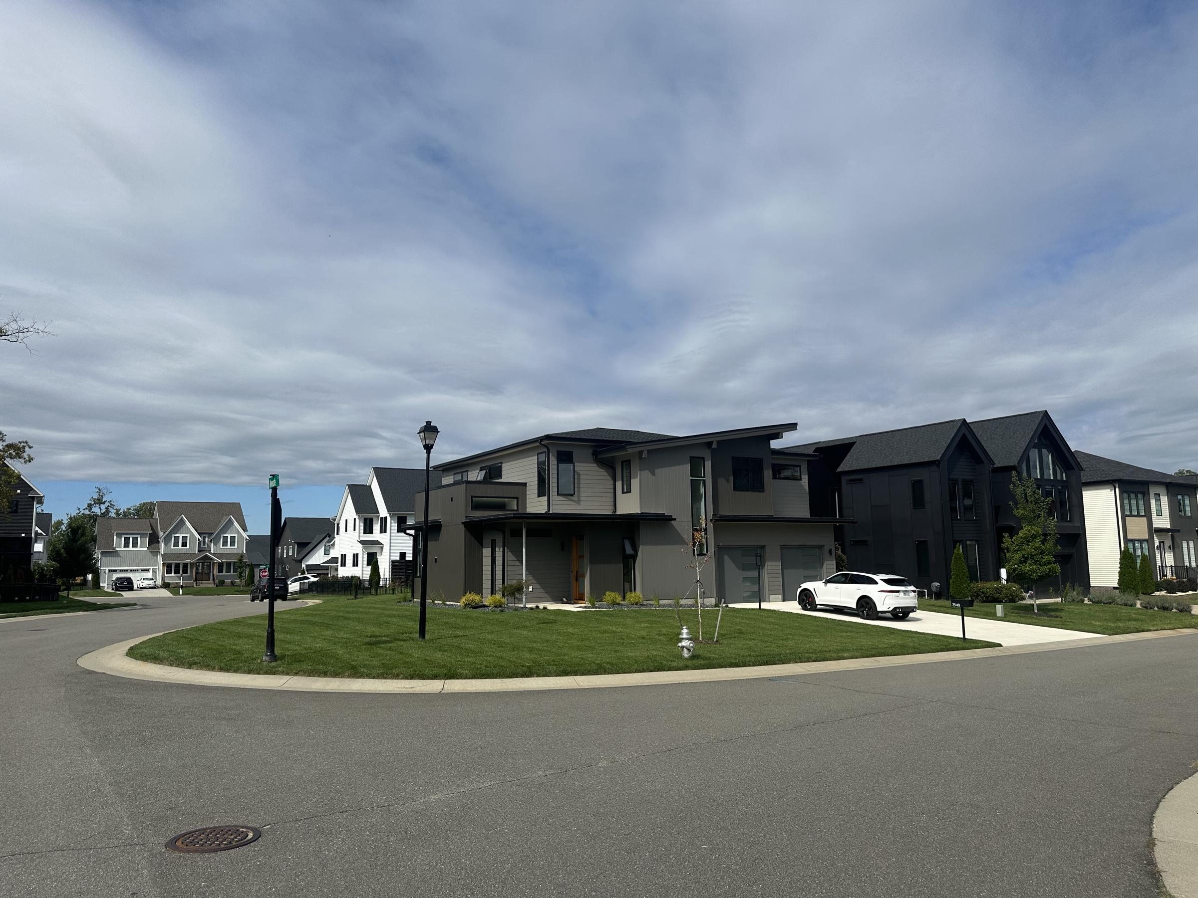 A curving street of new homes at Rountrey